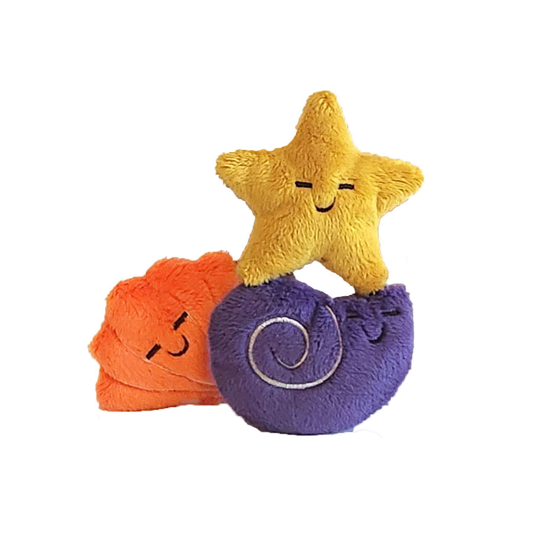 plush yellow star, purple snail, and orange shell